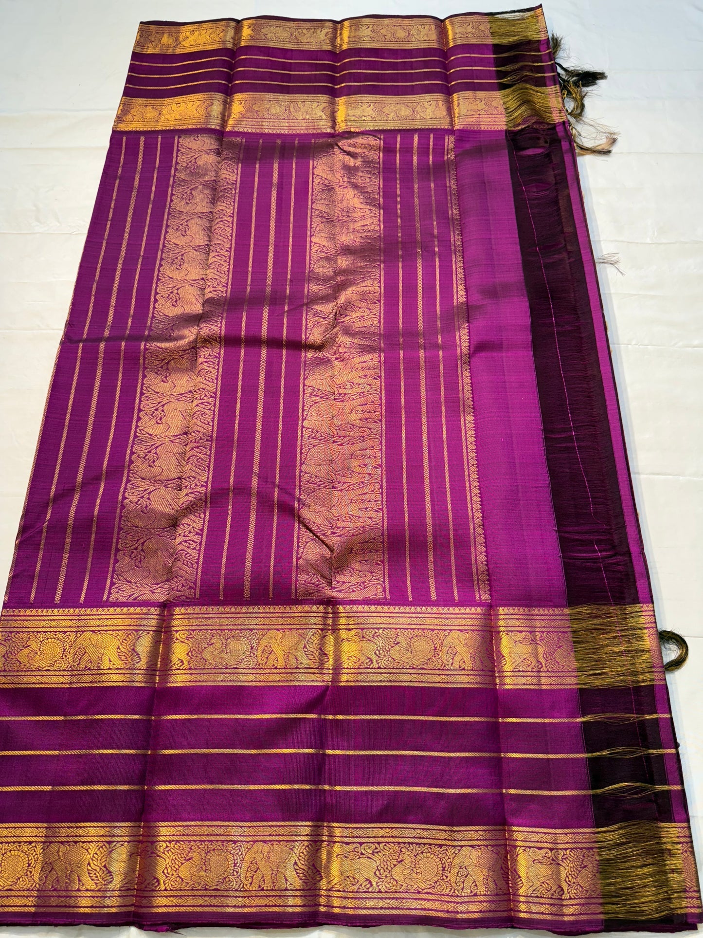 Swarna Sugantham — Pure Silk Kanchipuram Saree
Ombre rose-to-blush pink body with zari paisley buttas and rich rani-magenta borders in gold vine motifs.
Silk Mark Certified • Blouse Stitching Available ($30) • Free USA Shipping • Ships in Two Weeks.