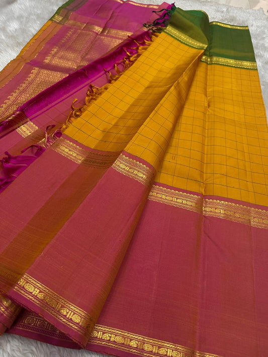 Kesari Checks — Pure Silk Kanchipuram Saree (almost -Mubbagam)
Saffron yellow body in grid kattam weave with radiant pink borders and zari detailing
Silk Mark Certified ✅ • Free USA Shipping • Ships in Two Weeks
