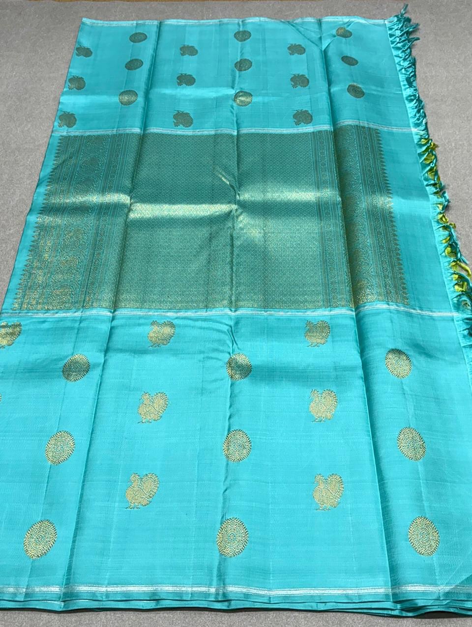 Aaral – Ice Blue & Spring Green Mubbagam Kanchipuram Pure Silk Saree with Mayil Chakram Buttas & Vanasringaram Grid Pallu