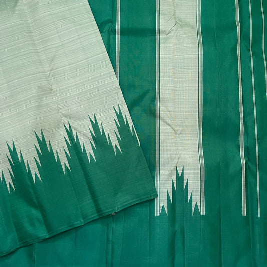 Deep emerald-green Kanjivaram pure silk pallu with fine sage vertical woven stripes and elongated geometric panels.