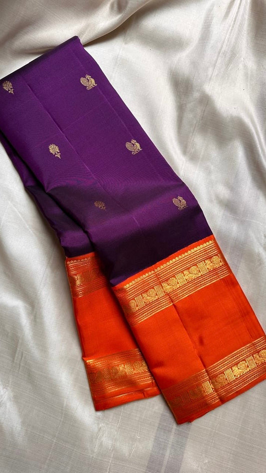 Pure silk kanchipuram handloom saree with purple body mayil floral butta orange border intricate pallu