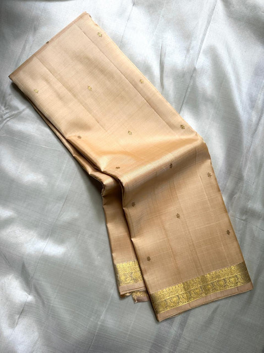 Small Border Sandal | Pure Kanchipuram Silk Saree
A serene sandal beige body adorned with subtle gold zari buttas & temple-inspired border ✨
Silk Mark Certified • Free USA Shipping • Ships in Two Weeks