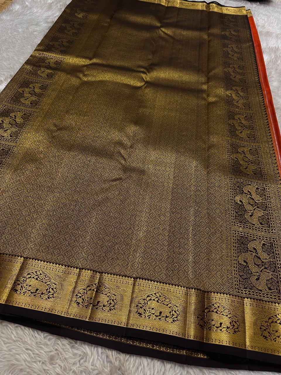 Tamra — Rust Vairaoosi Kanchipuram Pure Silk
 
Coffee Brown Korvai Border & zAri Pallu
 
elephant motifs  Medallions & Annam Panels in Gold Zari
 
Silk Mark Certified | Free Shipping within USA
 
Ships in Two Weeks | Blouse Stitching $30