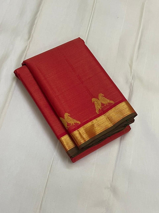 Sindoor Kili Vairaoosi — Pure Silk Kanchipuram Saree
Arakku-red body with twin parrot buttas and marigold-orange kasu jaal pallu
Silk Mark Certified • Ships in Two Weeks • Free Shipping within USA