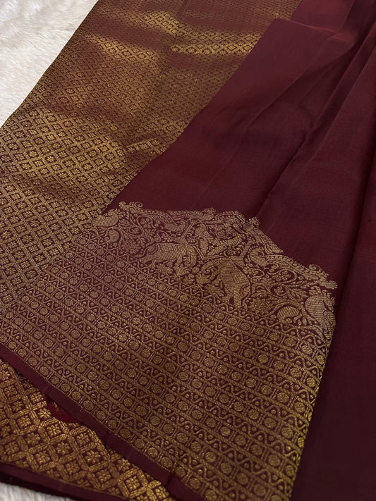 Lotus Glow — Brown | Pure Kanchipuram Silk Saree
A regal brown-maroon canvas adorned with gold zari peacocks, elephants & lotus buttas ✨
Silk Mark Certified • Free USA Shipping • Ships in Two Weeks
