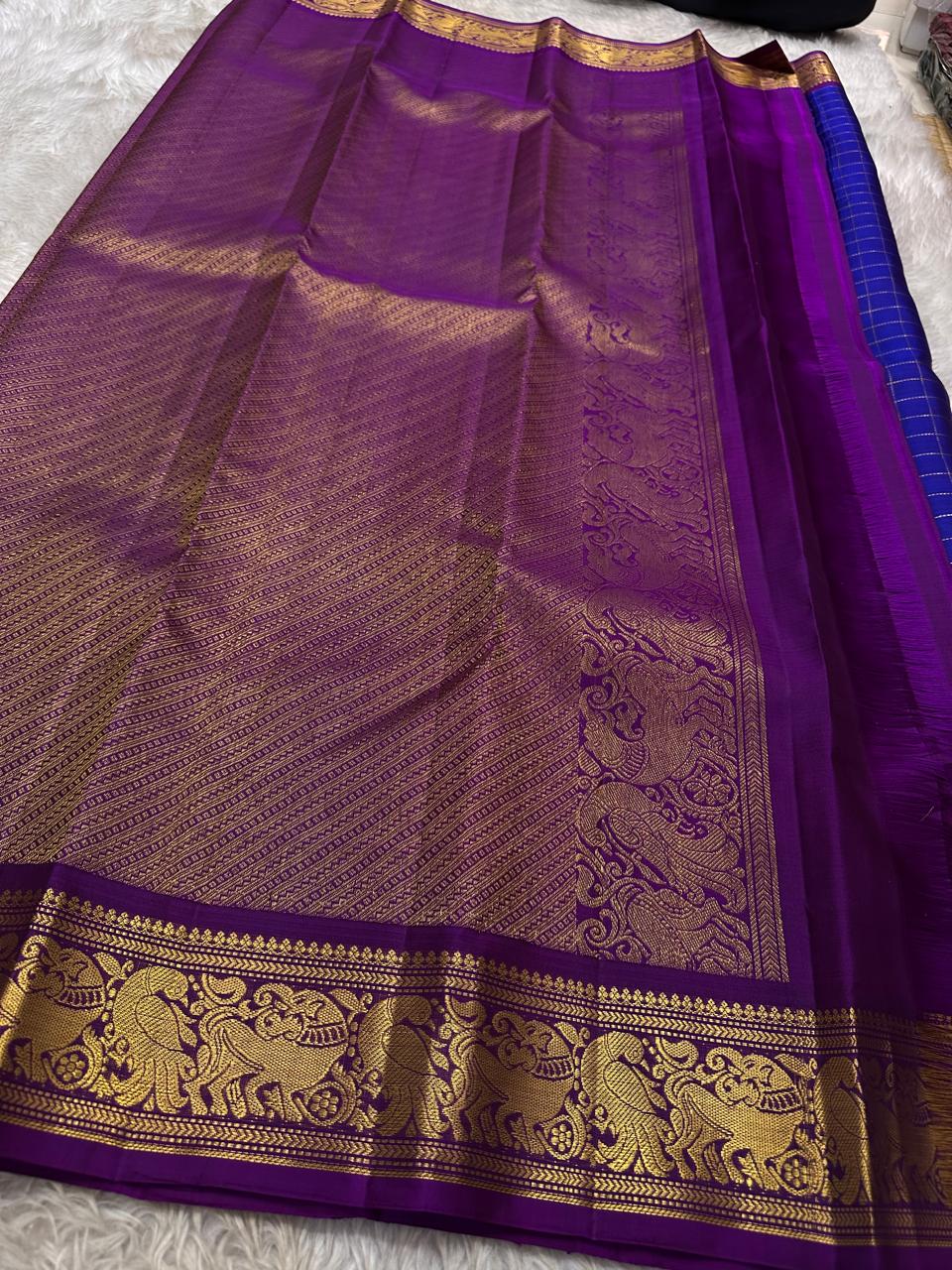 Sorgavaasal Kili , stunning motif in MS blue and purple zari kattam zari woven yazhi buttas in pure silk kanchipuram