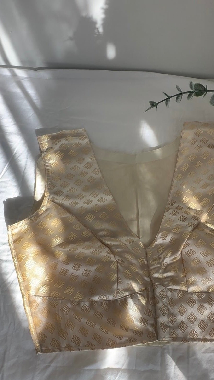 Cream and gold Banarasi silk blouse front view showing woven brocade pattern