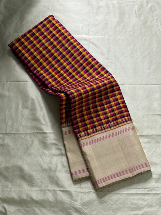 Venpattu Kattam Thazampoo Reku — Pure Kanchipuram Silk Saree
Multicolor kattam body: rani pink • manjal yellow • ink blue/black • deep purple/green accents
(venpattu) borders with pink selvedge lines & thazampoo reku 
Silk Mark Certified  free shipping