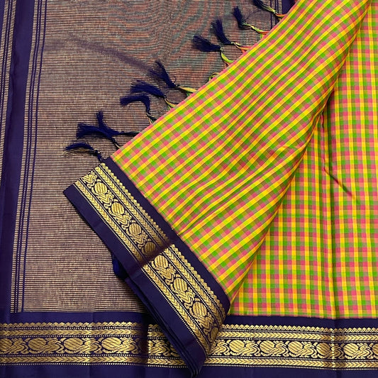 Forest Blossom Kattam — Pure Silk Kanchipuram Saree
Parrot-green, rani-pink & haldi-yellow kattam checks
Deep navy korvai borders with antique gold zari vines
Rich navy zari-striped pallu with tasseled edges
Silk Mark Cert • Free USA Shipping 1 week