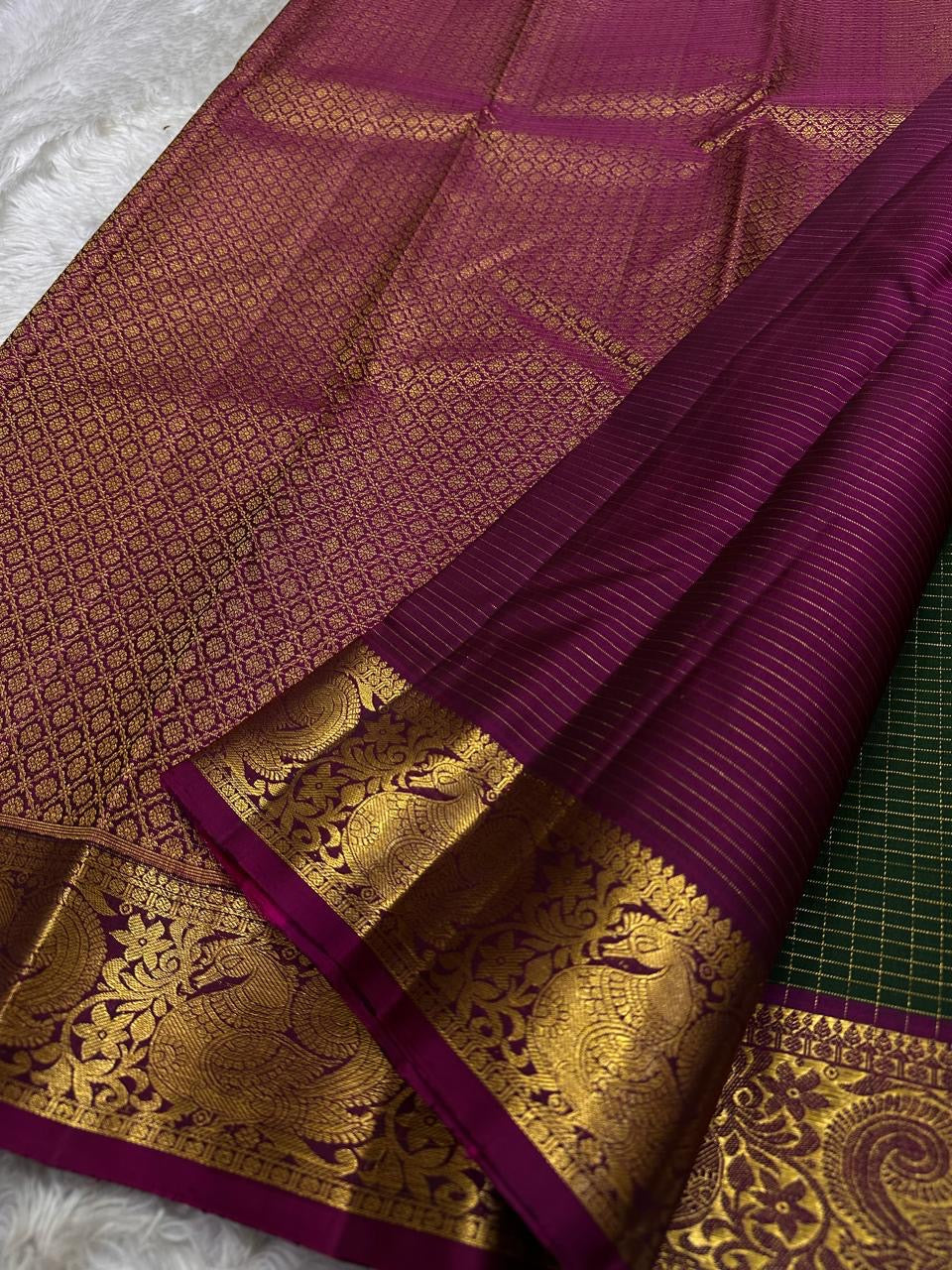 Hemavalli Zari Kattam: Stunning Emerald Green & Rani Pink Korvai Pure Silk Kanchipuram with Gold Zari Checks
Silk Mark Certified for Quality Assurance, Enjoy Free Shipping within USA.
Ready to Ship in 2 Weeks with Majestic Peacock Borders.