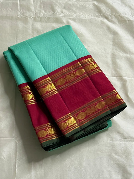 Neer Pachai Vairaoosi — Kanchipuram Pure Silk saree 
Sea-foam/aqua body with classic Vairaoosi pinstripes
Contrast ruby-maroon korvai borders with gold chakram & floral panels
Grand maroon pallu with all-over chakram jaal and paisley vines; aqua tassel