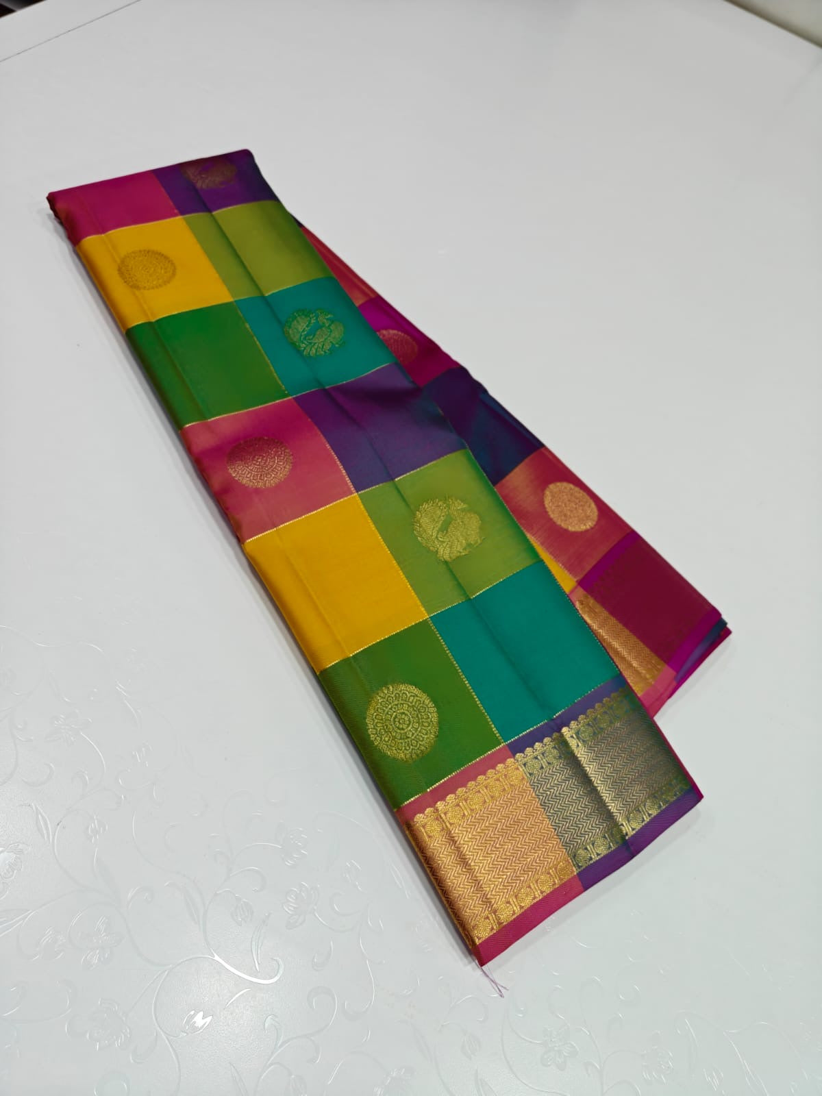 Navaratnam Paalum Palamum ✨ – Pure Kanchipuram Silk Saree
Multi-Color Kattam with Zari Mandala Buttas
Rani Magenta Korvai Border & Grand Zari Brocade Pallu
Contrast Rani Magenta Blouse with Matching Zari Border
Silk Mark Certified ✅ | Ships in 2 weeks