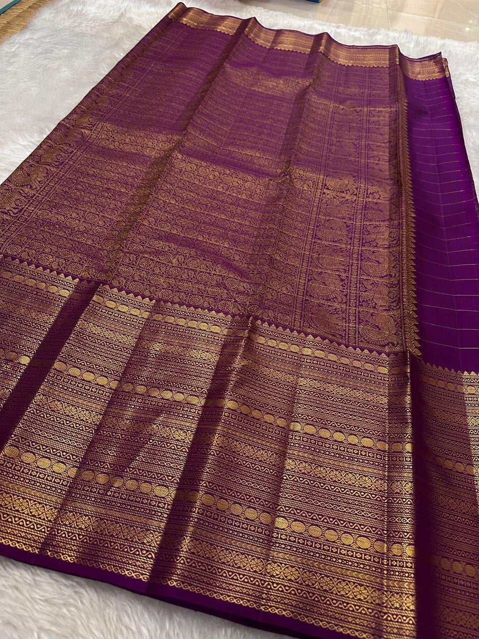 Purple with gold Zari kattam with ornate border pure silk Kanchipuram with mayil chakram zari butta and detailed Pallu