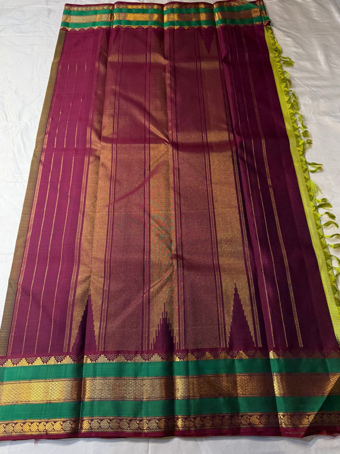 Gita
Pure Silk Kanchipuram Saree
Sampanga & Pea Green Podi Kattam
Arakku Border with Triple Zari Bands