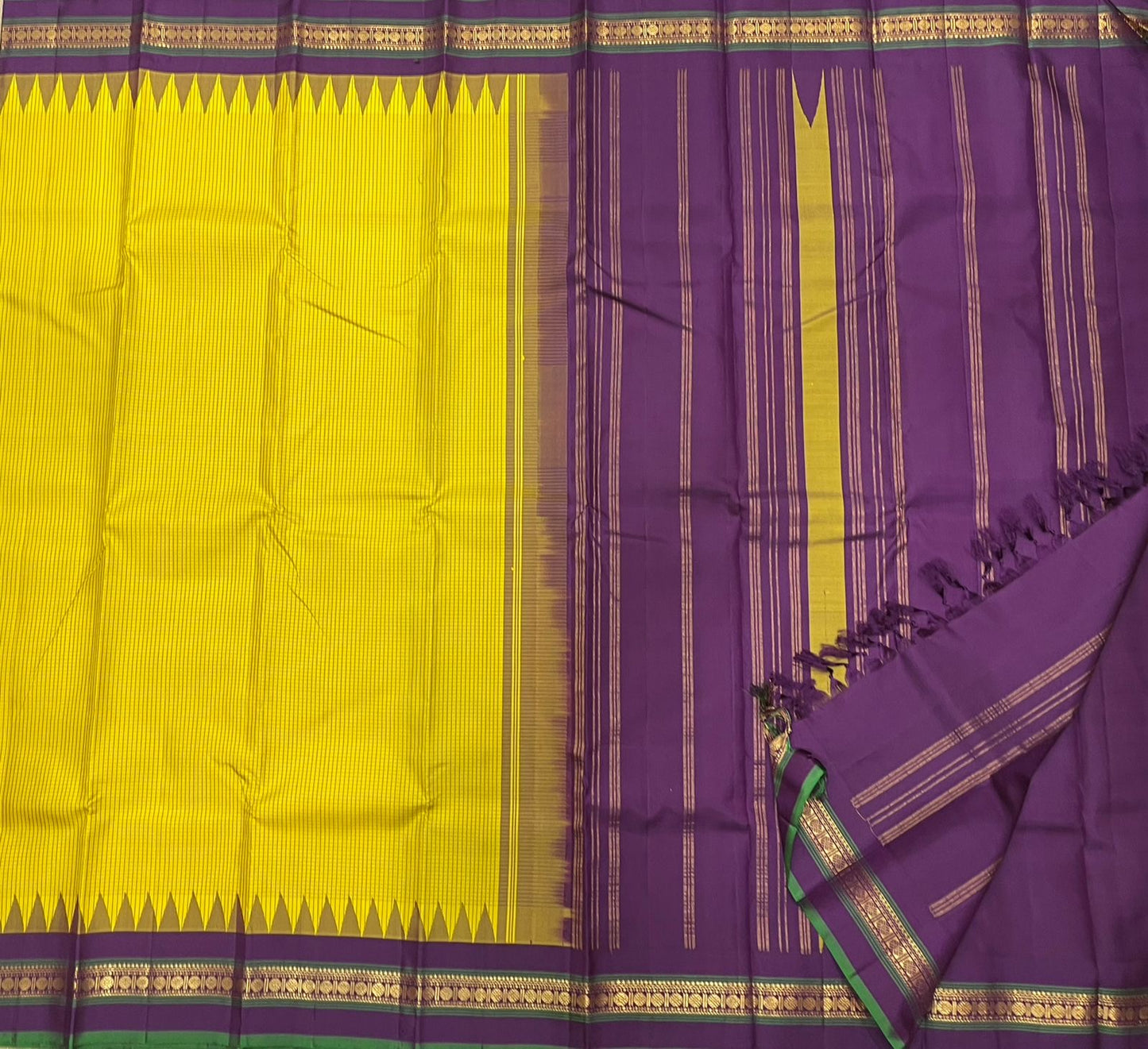 Ochre Turmeric Kattam
Pure Kanchipuram Silk Saree – Ochre Yellow Body with Fine Kattam Checks
Contrast Korvai Borders with Temple Serrations & Floral Zari
Grand Zari Brocade Pallu with Hand-Knotted Tassels
Silk Mark Certified ✅ |ships in 2 weeks