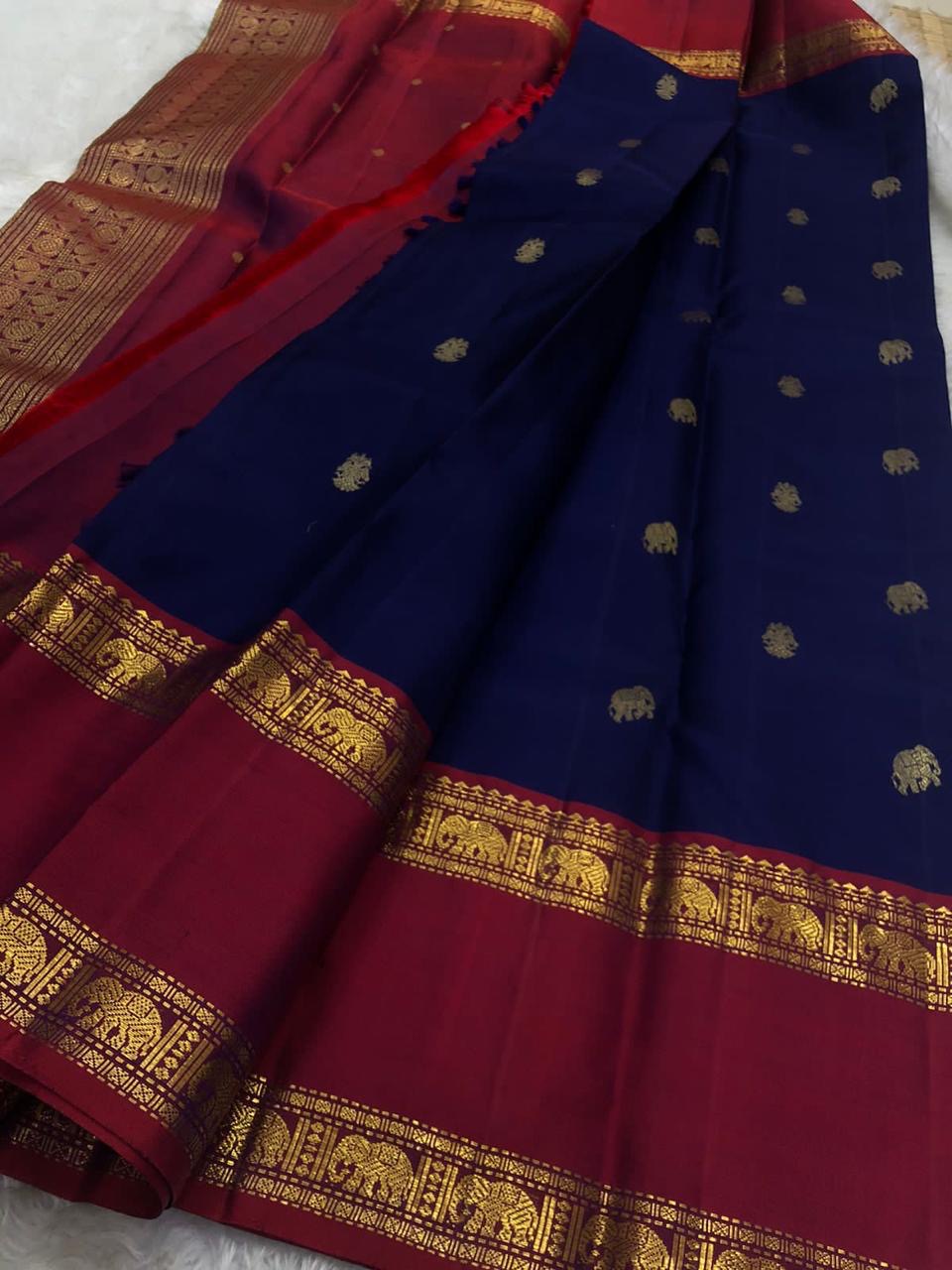 ✨ Gandaberunda Neela Varnam — Pure Silk Kanchipuram Saree ✨
Royal navy body with gold elephant & Gandaberunda motifs, rich araku-maroon korvai borders, and temple zari pallu.
Silk Mark Certified ✅ • Fall & Pico Done ✅ • Blouse Stitching Available ($30) ✅