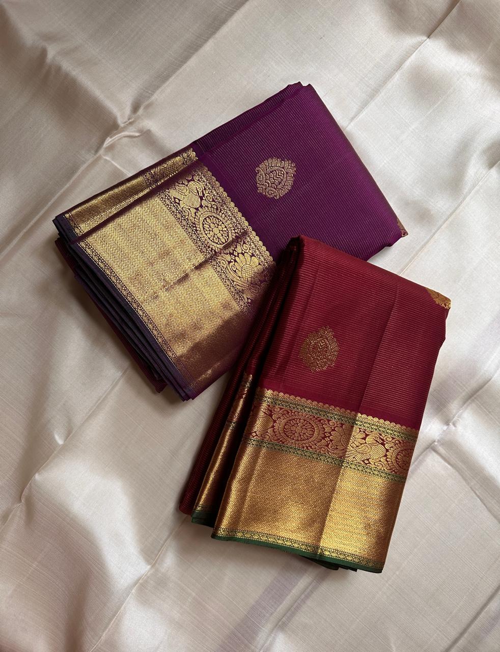 Burgundy Vairaoosi – Pure Kanchipuram Silk Saree
Classic burgundy body woven with Vairaoosi ✨
with delicate gold floral medallion buttas for temple elegance
antique-gold korvai borders with rosettes & chevron. Silk Mark Certified, delivery in 2 weeks