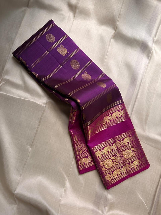 Rani Pink Plum Zari Stripes – Pure Kanchipuram Silk Saree
Plum purple body with rani-pink korvai borders & grand zari pallu
Elephants & floral mandalas woven in gold zari
Silk Mark Certified | Blouse Piece Included | Fall & Pico Done
Free shipping