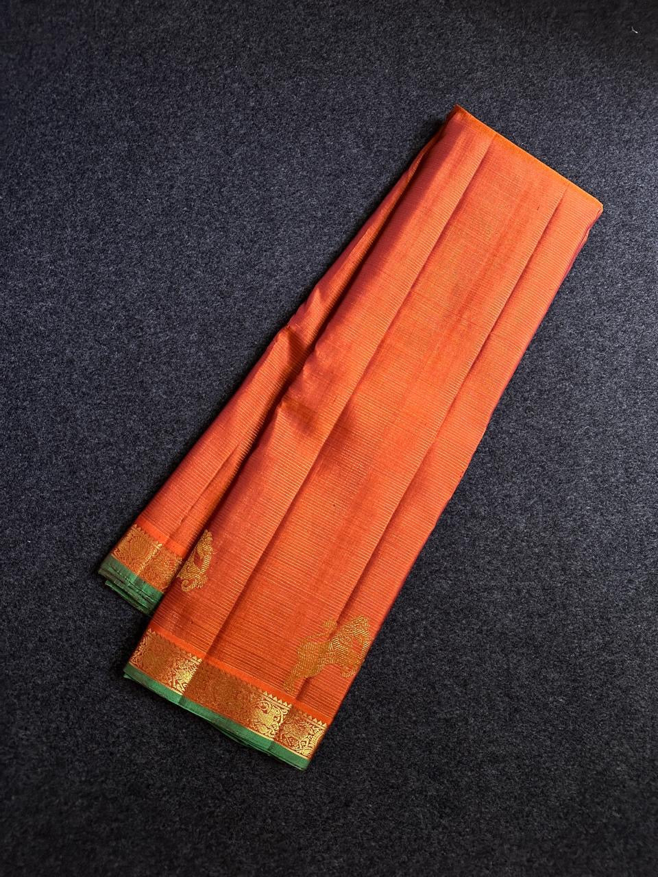 Rust Orange Yazhi Vairaoosi — Pure Silk Kanchipuram Saree
Rust orange body with fine vaira oosi lines and regal Yazhi zari motifs
Antique gold borders with green selvedge and grand brocade pallu ✨
Silk Mark Certified • Free USA Shipping • Ships in Two We