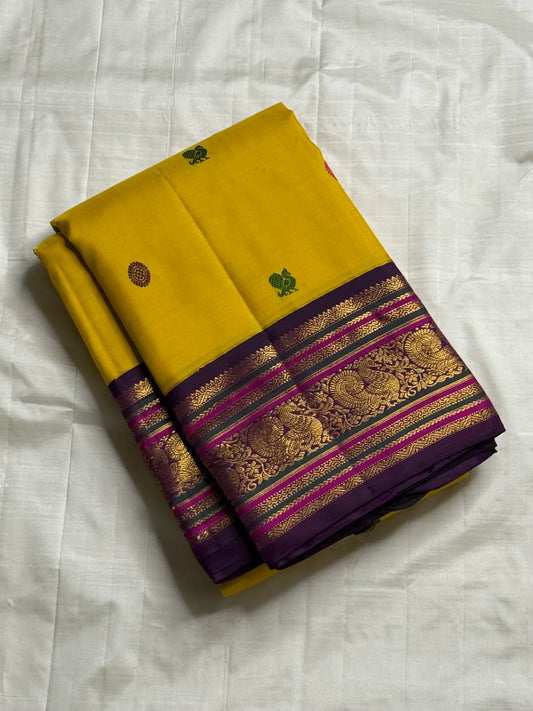 Kili Manjari — Pure Silk Kanchipuram
Haldi Yellow • Parrot & Coin silk thread Buttas • Plum Zari Border
Silk Mark Certified ✅ Free  Shipping ✅ Ships in 1 week ✅