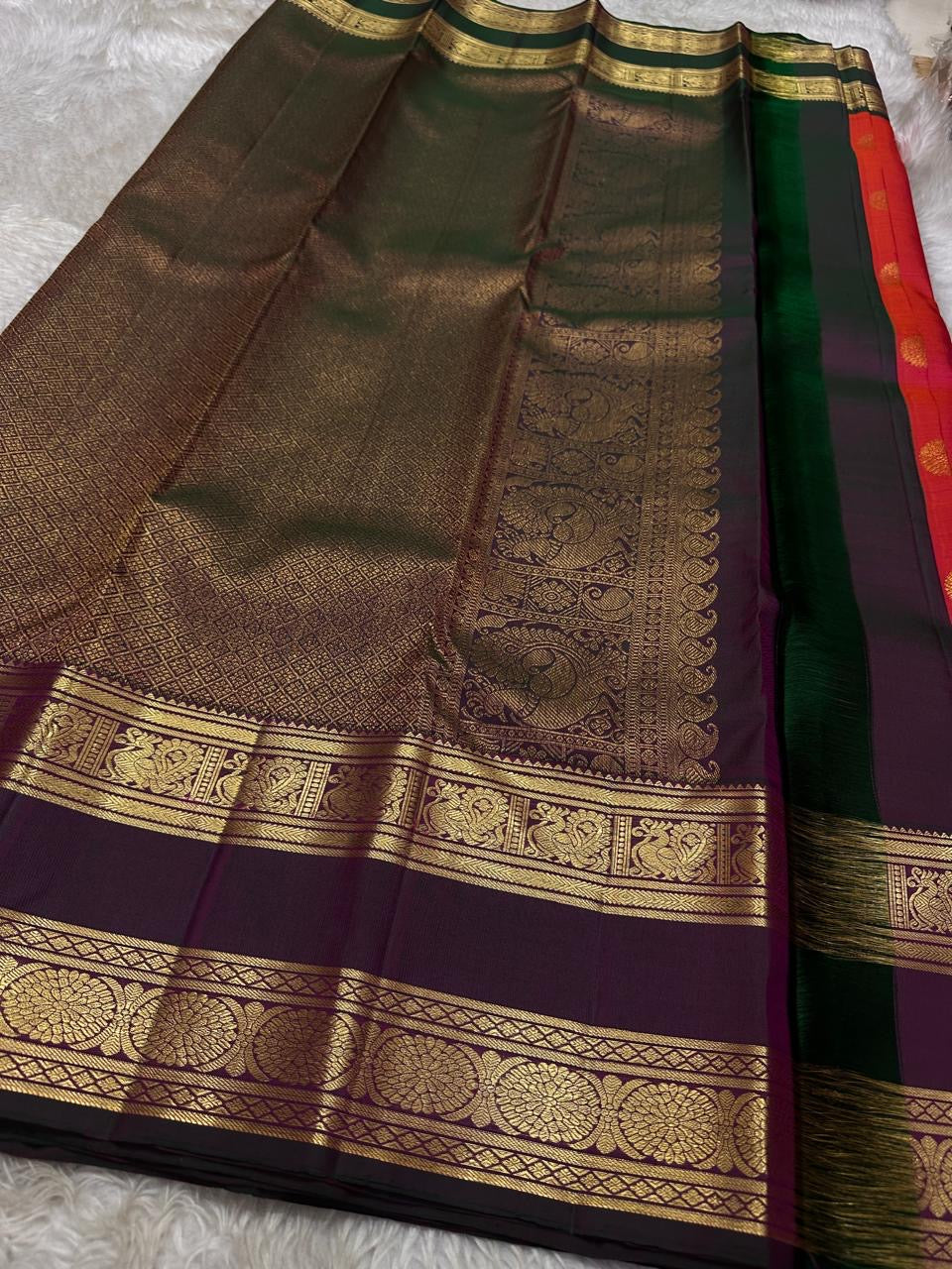 Vivid red shot deep pink with coffee brown Mayil Kamalam rettapettu border and butta paisley Zari woven butta on body pure silk Kanchipuram saree