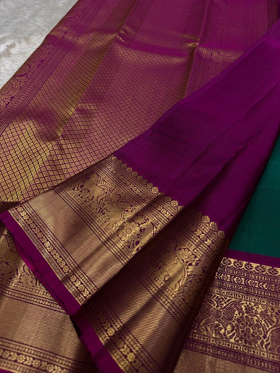 Peacock Green Pushpam – Pure Silk Kanchipuram Saree
 floral butta body with magenta contrast floral zari border
Grand woven zari pallu with traditional medallions & motifs
Silk Mark Certified | Free Shipping within USA
Ships in 1 Week | Fall & Pico