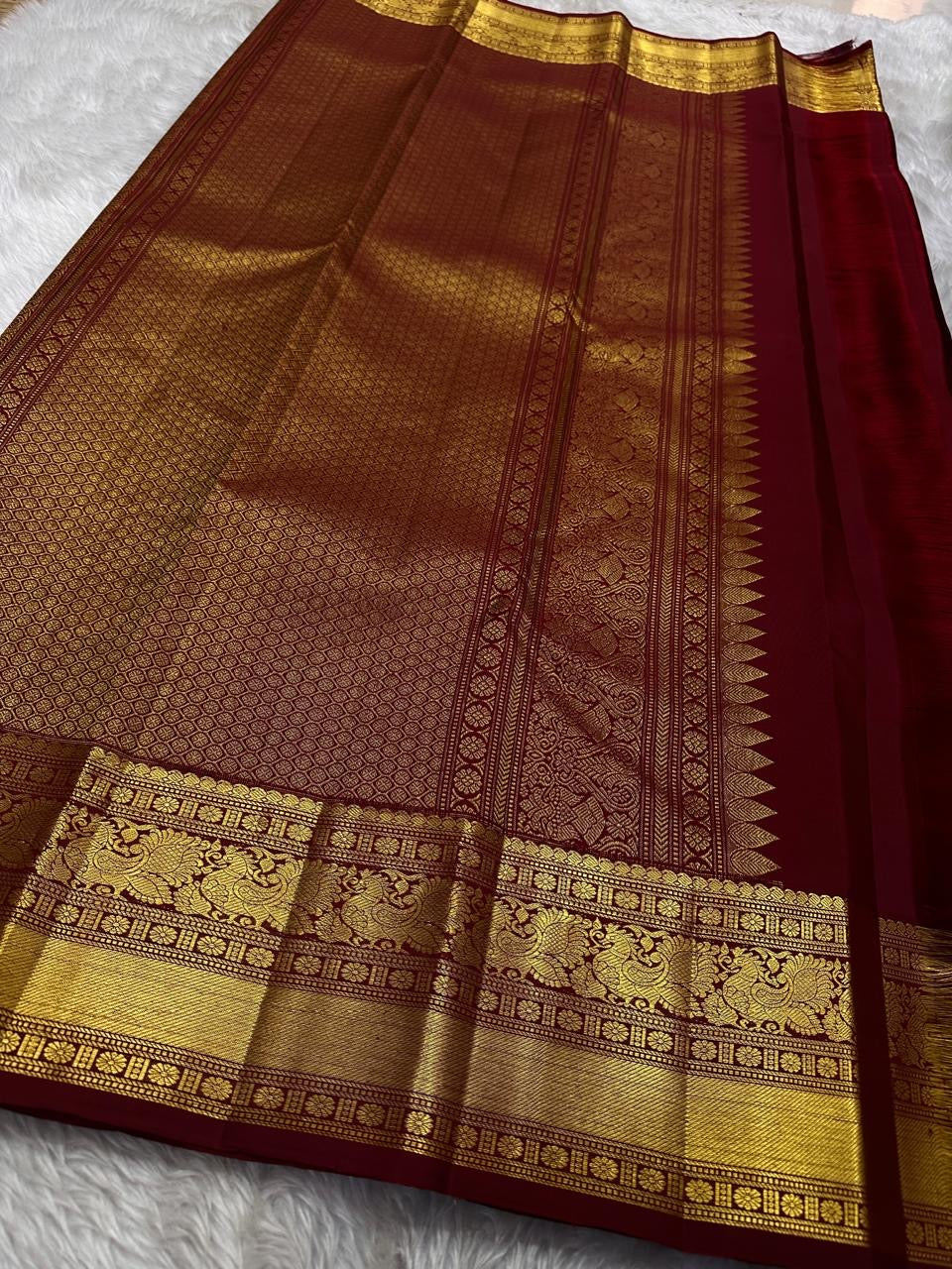 Deep brown small flower motif with vanasringaram and Rudhraksham border pure silk mark certified Kanchipuram saree