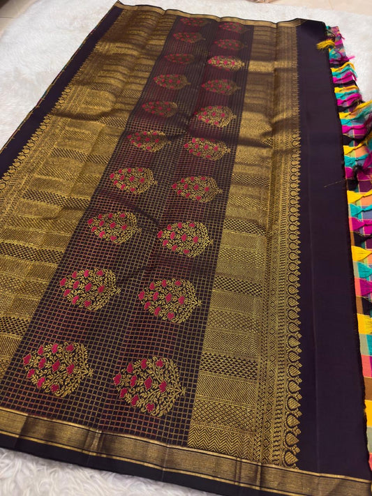 Handwoven Kanjeevaram silk saree featuring turquoise, magenta, purple and gold checked weave