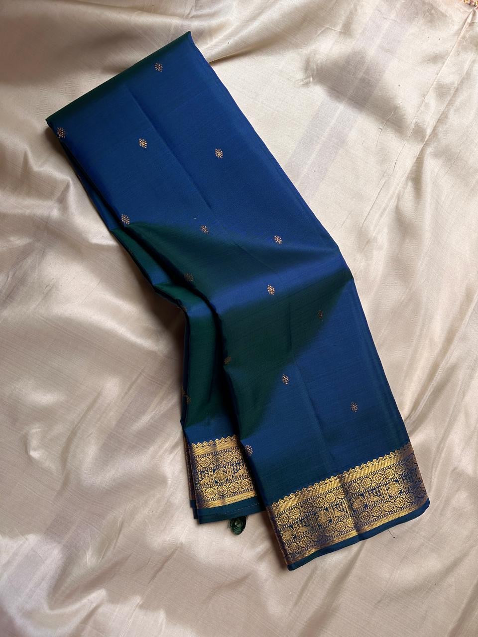 Indira – Peacock Blue-Green Kanchipuram Pure Silk Saree with Zari Butta & muthu seer and rudraksham Pettu Border