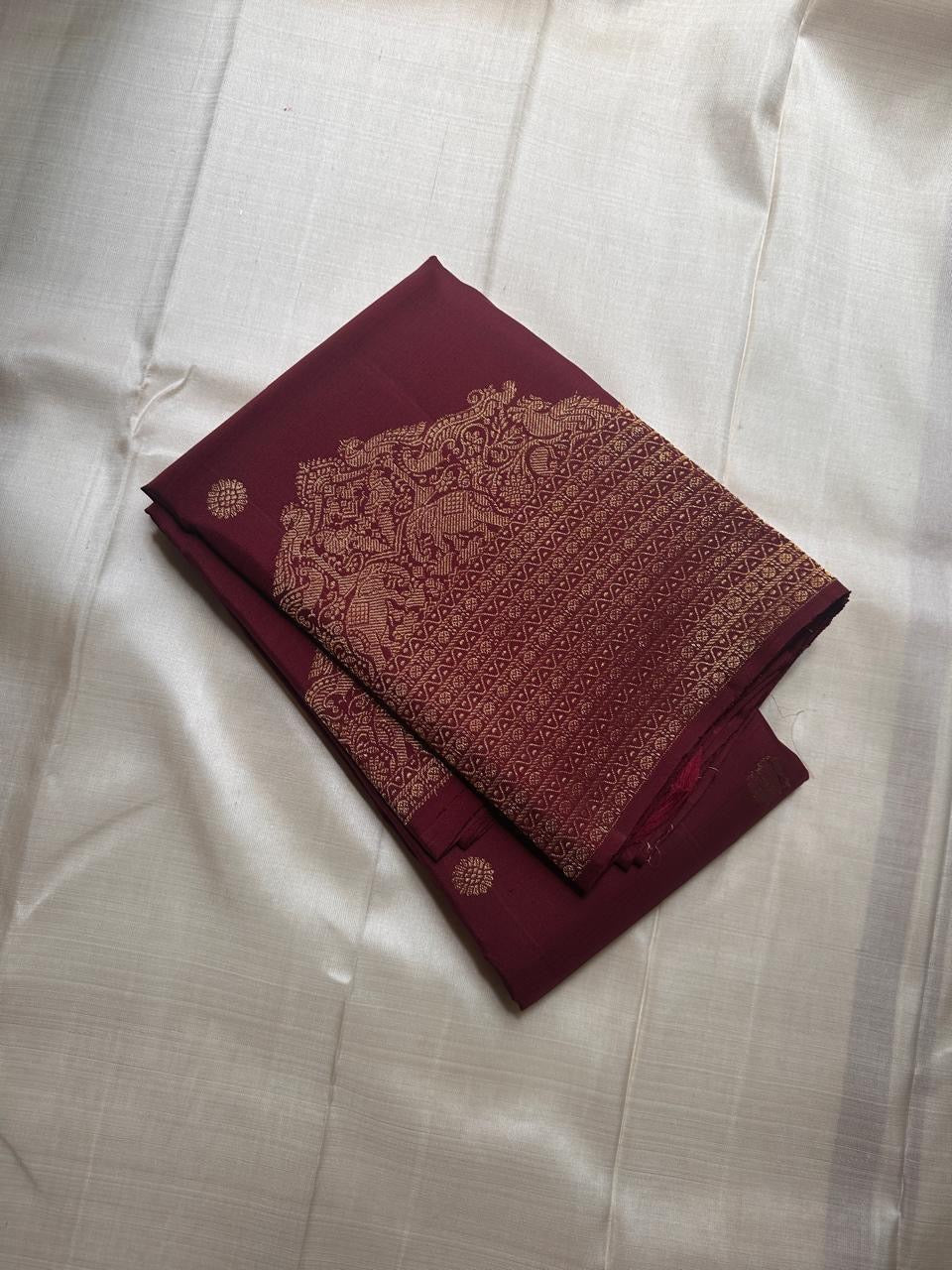 Lotus Glow — Brown | Pure Kanchipuram Silk Saree
A regal brown-maroon canvas adorned with gold zari peacocks, elephants & lotus buttas ✨
Silk Mark Certified • Free USA Shipping • Ships in Two Weeks