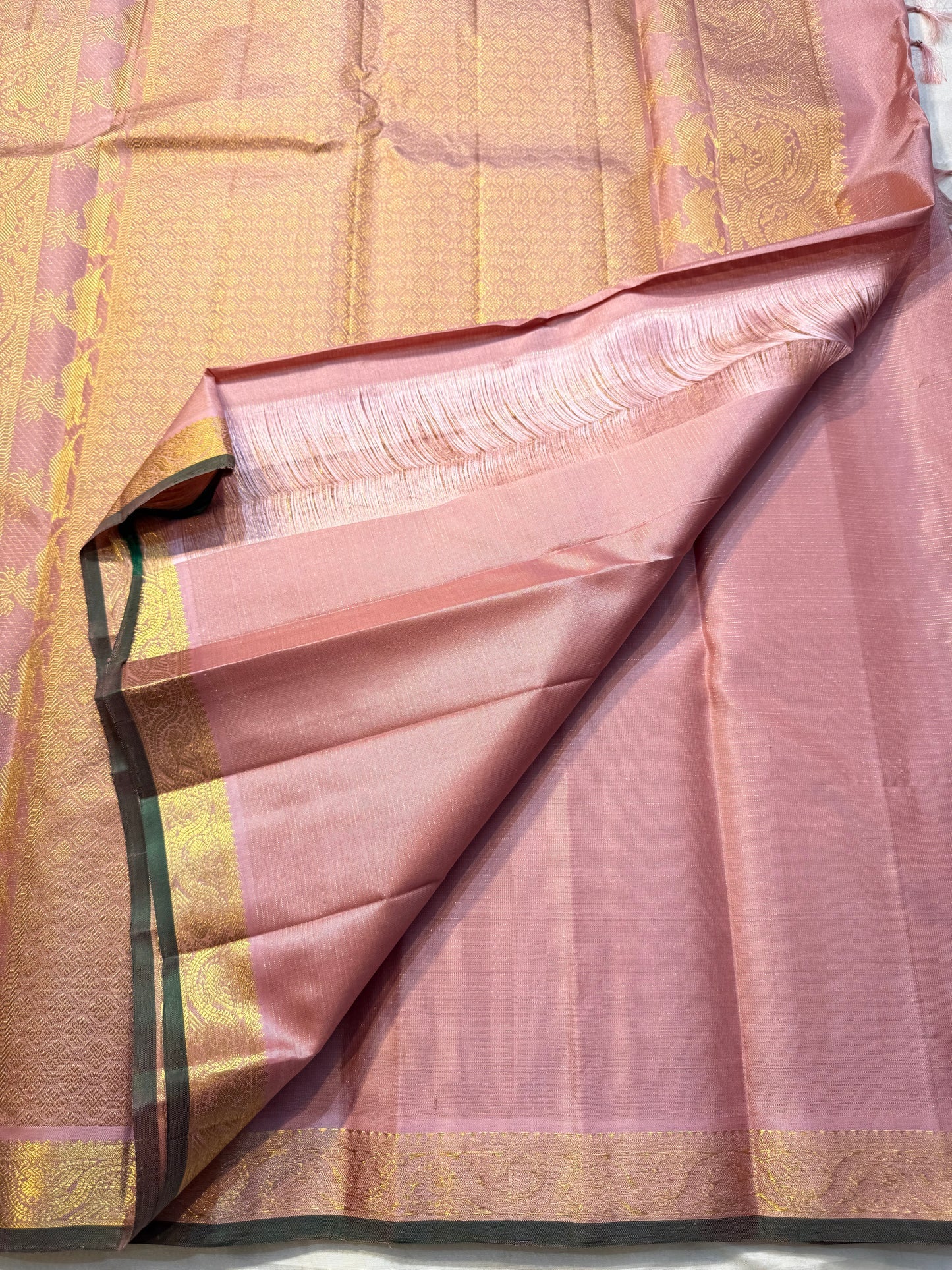 ilam Thamarai — Pure Silk Kanchipuram Saree
Blush rose-pink body with green korvai border woven in gold yaali & mayil motifs · Rich zari pallū with paisley vines · Running blouse included
Silk Mark Certified • Free Shipping within USA • Ships in 1 Week