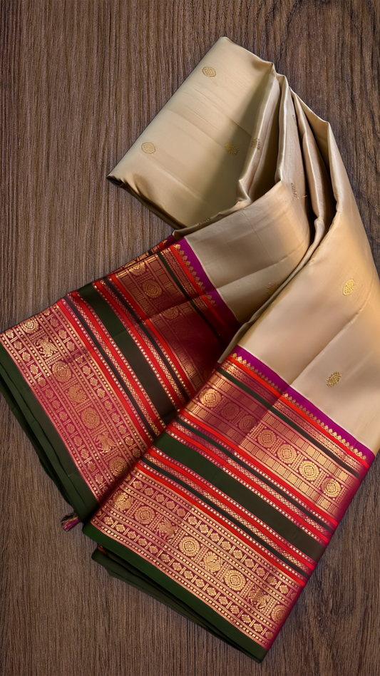 Mridula — Soft Biscuit Brown Kanchipuram Silk Saree
Biscuit-gold body with coin buttas, rani-green rettai pettu border & royal-purple brocade pallu
Silk Mark Certified ✅ • Ships in 1 Week • Free USA Shipping 🇺🇸blouse stitching available