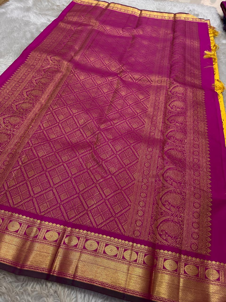 Manjula – Vibrant Yellow Pure Silk Kanchipuram Saree with Handwoven Magenta Benares-Style Dual Border, Maanthulir Green Selvedge, and Intricate Paisley, Rudhraksham & Floral Motifs on Pallu
