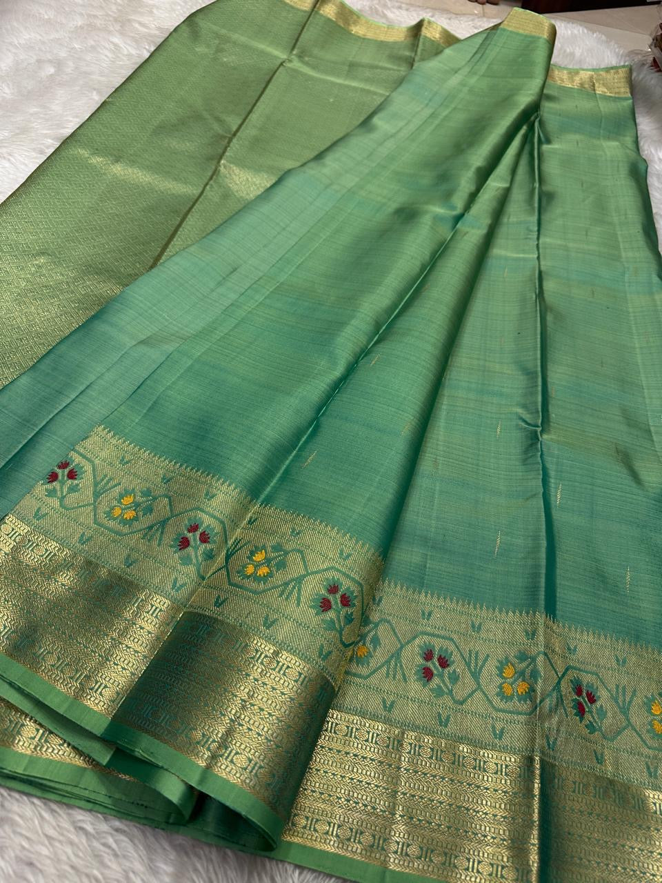 Vibha pastel sage green Pure Kanchipuram Silk Saree Blending the Grandeur of South Indian Weaving with Paithani-Inspired Floral Zari Borders and a Lustrous Rose Gold zari Pallu