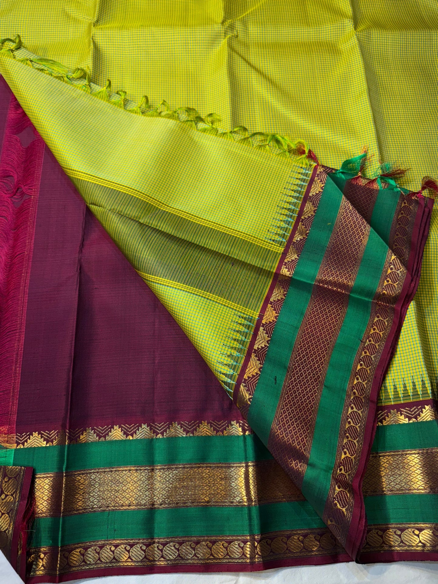 Gita
Pure Silk Kanchipuram Saree
Sampanga & Pea Green Podi Kattam
Arakku Border with Triple Zari Bands