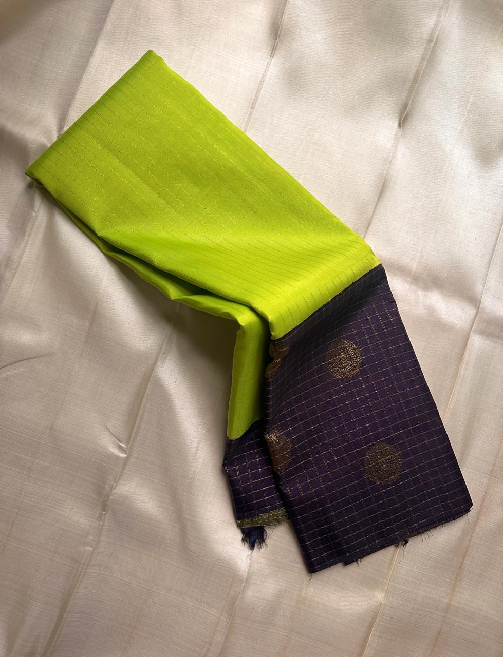 🌿 Venn Pachai – Deep Violet Checks & Lime Korvai Kanchipuram 🌿
✨ Pure Silk | Silk Mark Cert | Handloom Kanjivaram ✨
🪔 Violet & Gold Checks with Rich Zari Pallū | Bright Lime Green Body
🌸 Korvai | woven  Zari Buttas
Gandaberunda
🚚 Ships in 2weeks