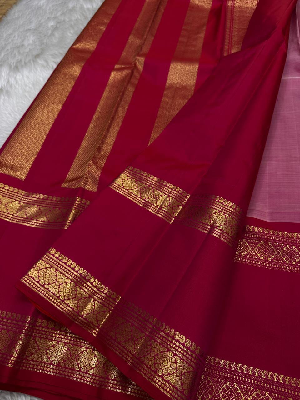 Pure silk kanchipuram rose pink color body with zari mayil chakram buttas , raspberry pink border with ornate Pallu