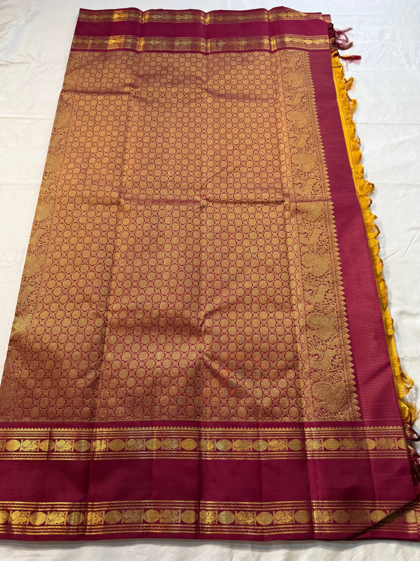Swarna Manjal vairaoosi
Pure Silk Kanchipuram Saree – Radiant Mustard Yellow Body with Maroon Border & Grand Brocade Pallu
Silk Mark Certified ✅
Fall & Pico Done ✅ | Blouse Stitching Available ($30) ✅
Free Shipping within the USA ✅ | Ships in Two Weeks ✅