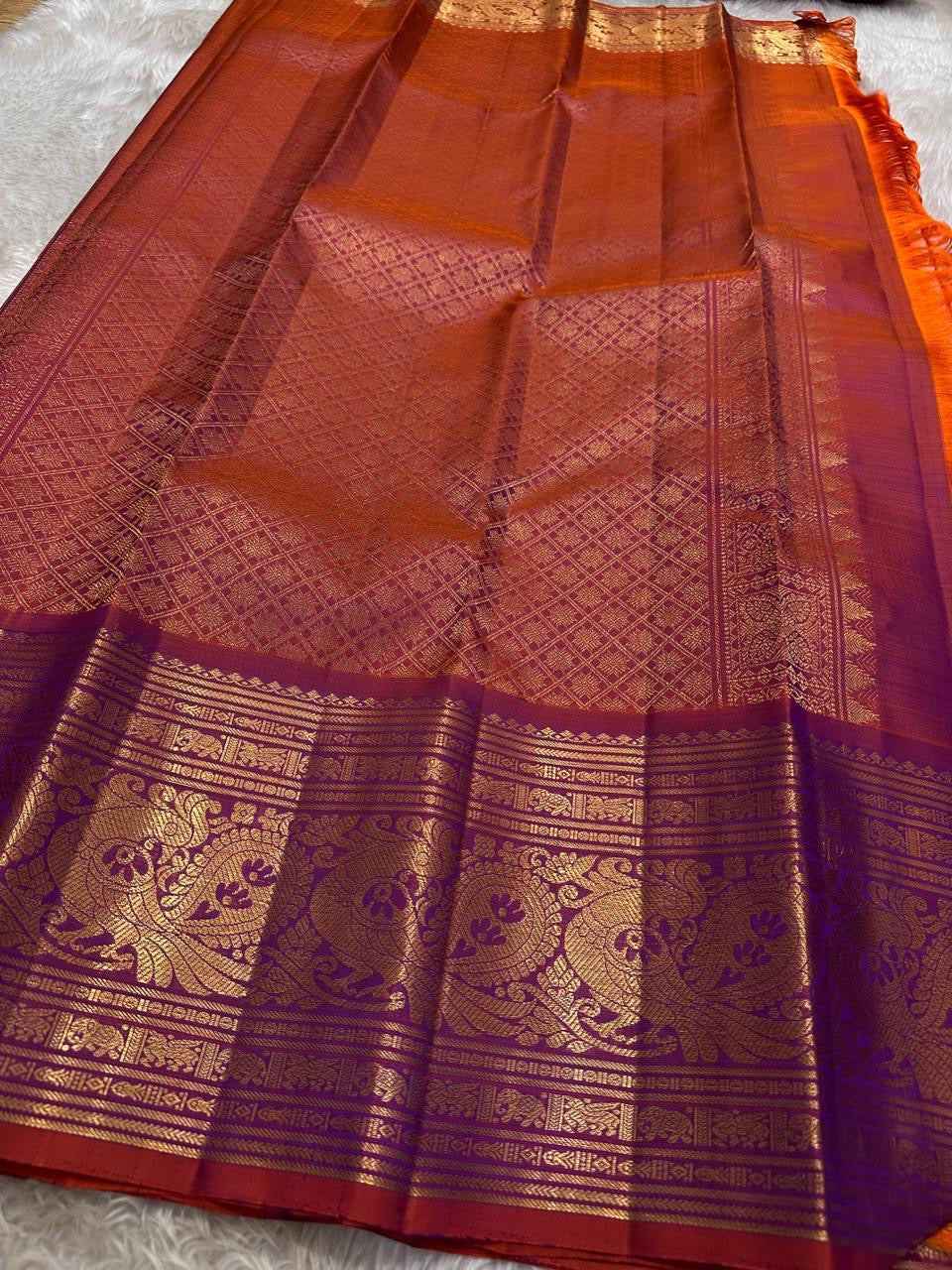 Royal purple and orange red double shade shot color Pallu pure silk Kanchipuram with ornate border featuring Peacock motifs