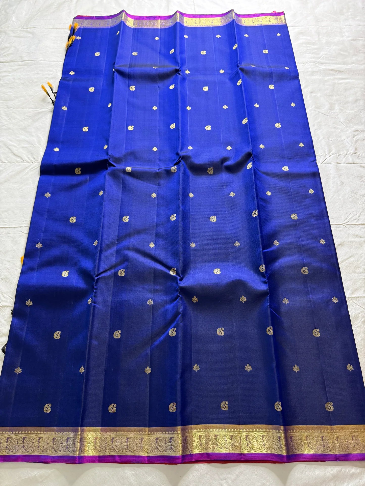 Devasri – Exquisite MS Royal Blue Silk Saree with Alternating Woven Zari Paisley & Floral Buttas, Petite Mauve-Purple Magenta Arai Maadam Border, and Breathtaking Golden Mustard Seer Pallu with Peacock Motifs