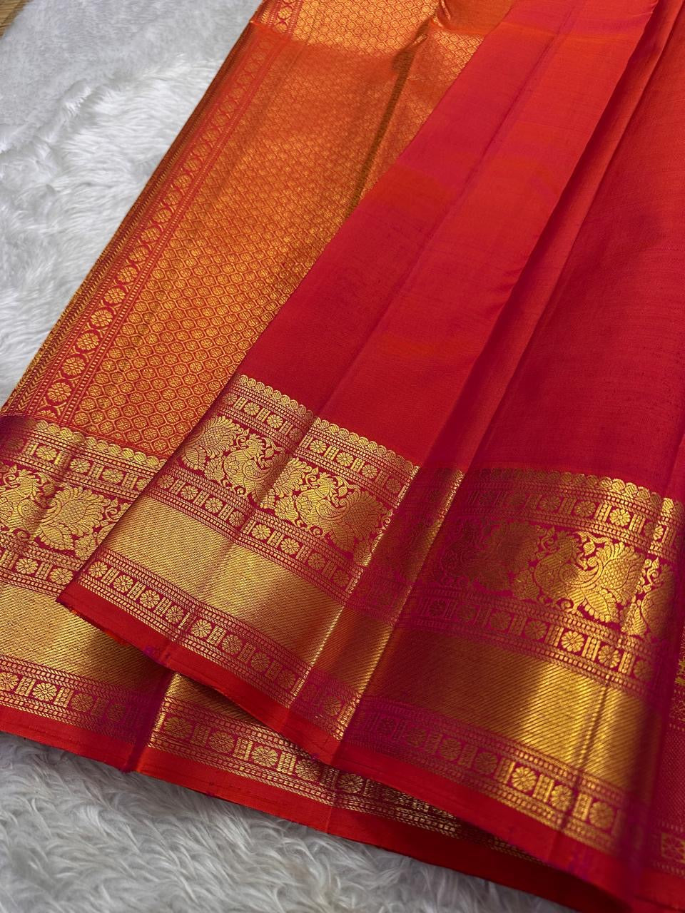 Fiery orange red shot double color small flower motif with vanasringaram and Rudhraksham border pure silk mark certified Kanchipuram saree
