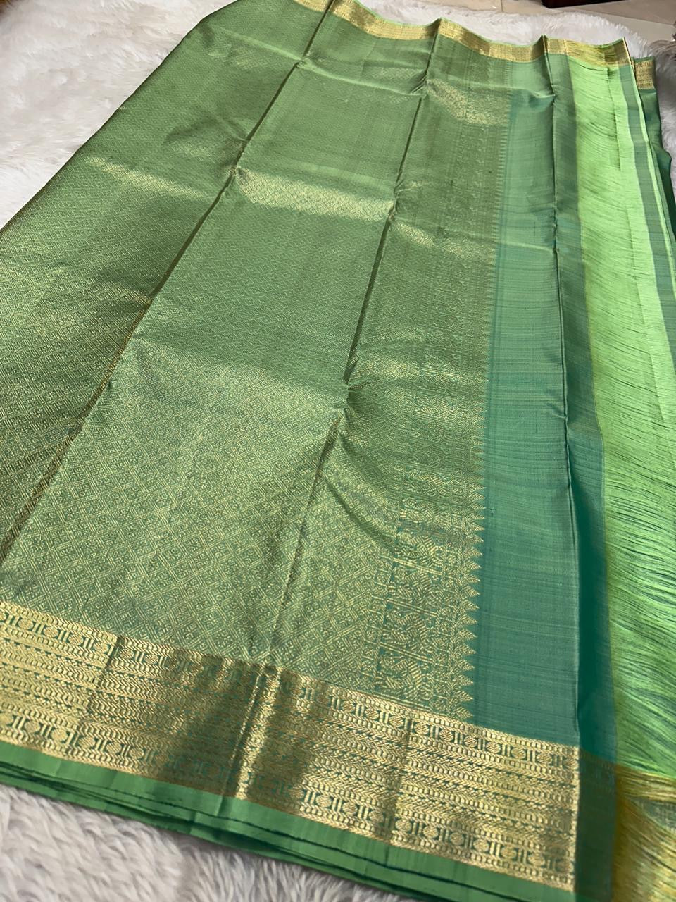 Vibha pastel sage green Pure Kanchipuram Silk Saree Blending the Grandeur of South Indian Weaving with Paithani-Inspired Floral Zari Borders and a Lustrous Rose Gold zari Pallu