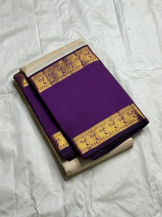 Ivory Violet Vairaoosi — Pure Silk Kanchipuram Saree
Pearl-Ivory Vairaoosi Body with Gold Round Buttas ✨
Deep Violet Korvai Border & Chevron Zari Pallu • Silk Mark Certified • Free USA Shipping • ships in 2 weeks