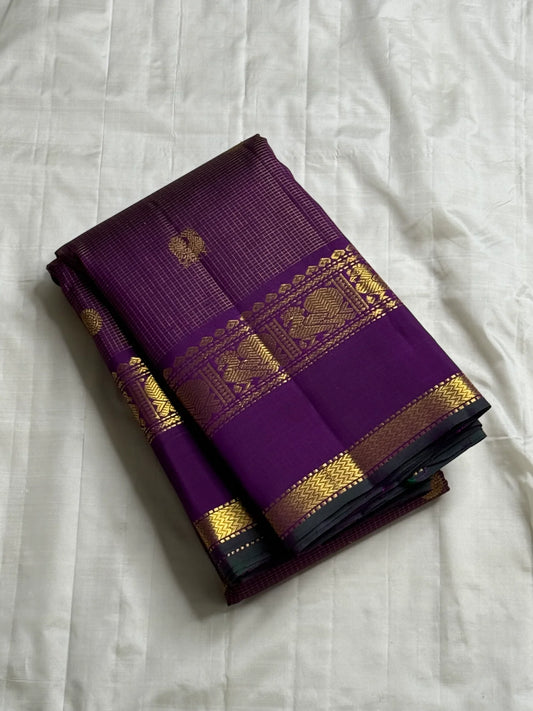 Kalika Purple — Pure Silk Kanchipuram Saree
Royal Purple with Gold Coin & Kalika Paisley Zari Buttas | Annapakshi Panel Border | Brocade Pallu
**Silk Mark Certified ✅ •ships in 2 weeks