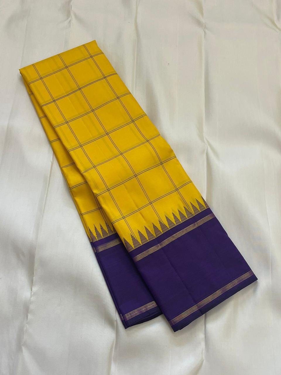 Haldi Violet Kattam Korvai
Pure Kanchipuram Silk Saree – Bright Haldi Yellow Checks with Contrasting Violet Korvai Borders
Minimal zari lines for an elegant look
Grand violet pallu with delicate zari stripes, silk mark certified, ships in 2 weeks
