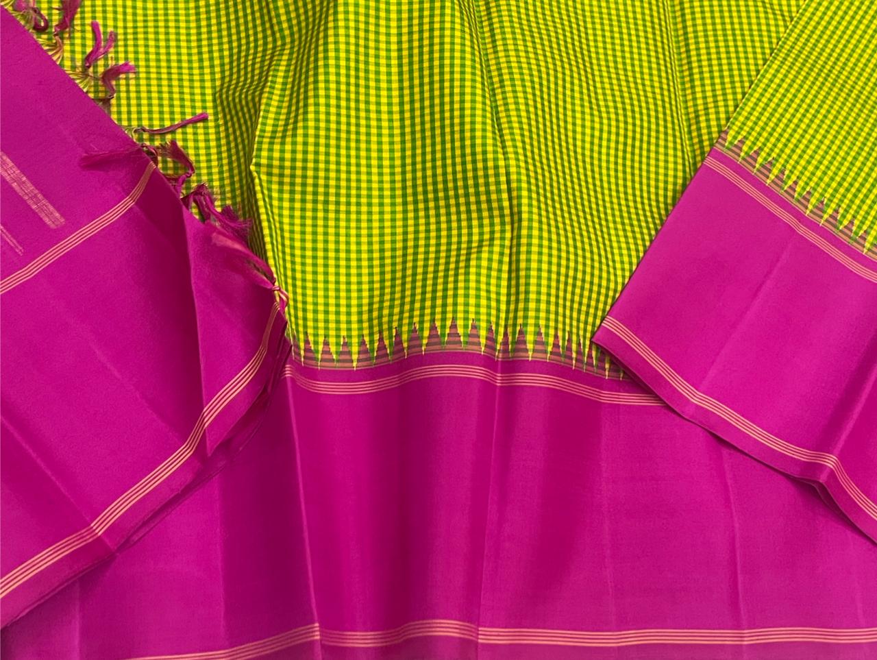 Rose Garden | Korvai Kanchipuram Pure Silk Saree
Magenta-rose body with parrot green micro-checks & temple Korvai join
Rettai pettu striped zari pallu | Contrast magenta blouse
Silk Mark Certified | Dry clean only
Ships in 1 week | Free Shipping USA