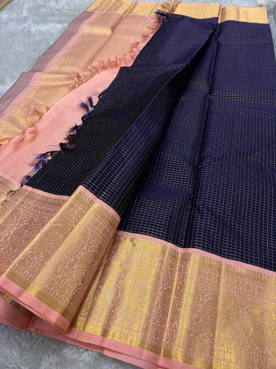 Deep navy blue Zari kattam with pink peach border peacock motif and Pallu