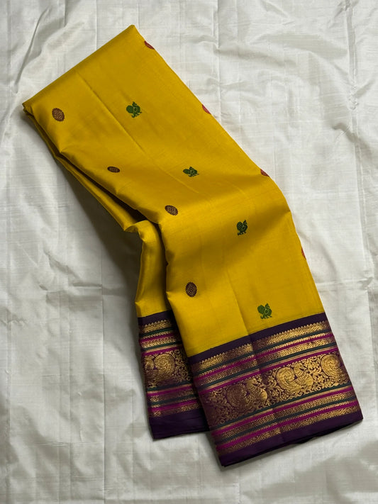 Kili Manjari — Pure Silk Kanchipuram
Haldi Yellow • Parrot & Coin silk thread Buttas • Plum Zari Border
Silk Mark Certified ✅ Free  Shipping ✅ Ships in 1 week ✅