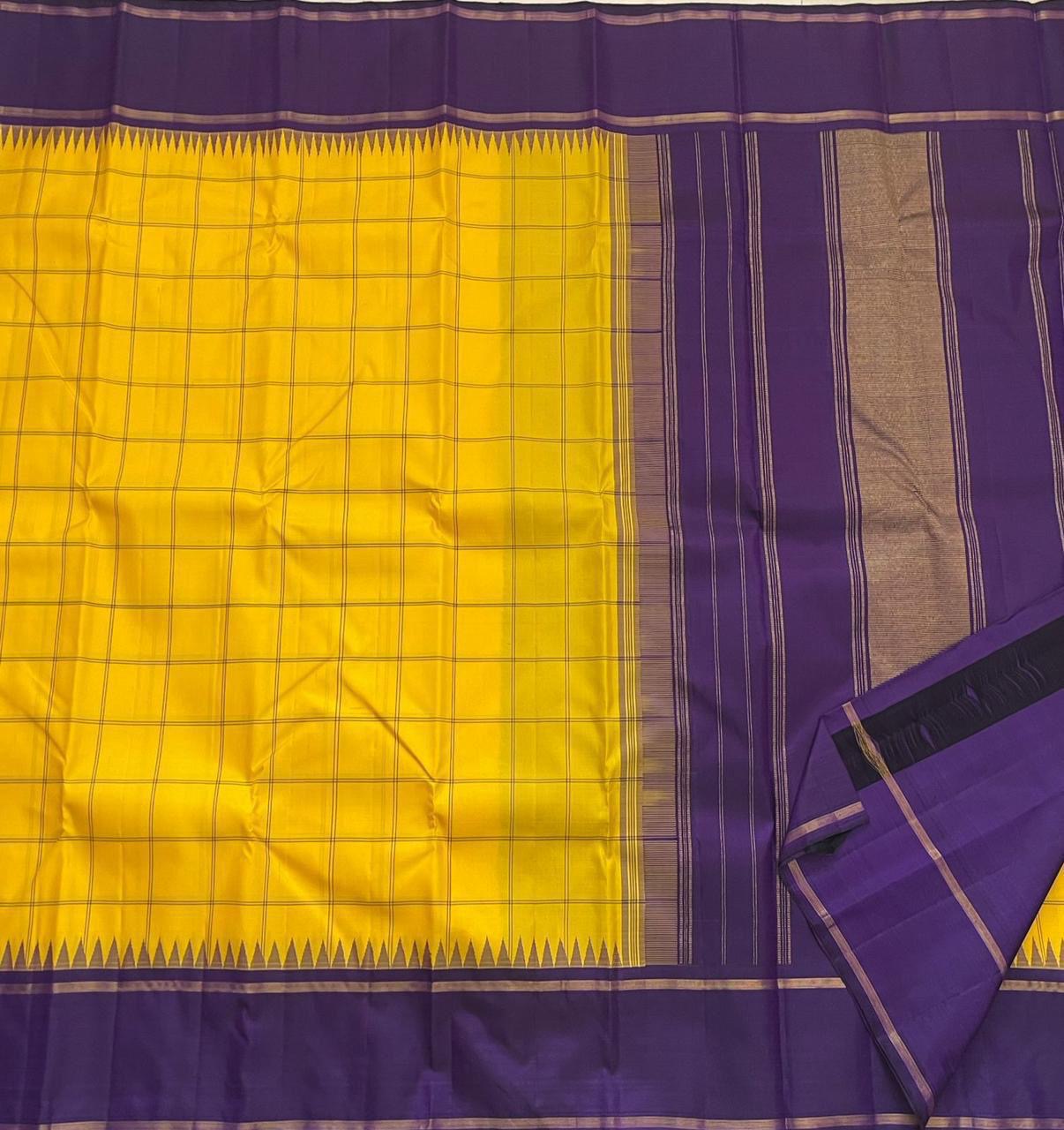 Haldi Violet Kattam Korvai
Pure Kanchipuram Silk Saree – Bright Haldi Yellow Checks with Contrasting Violet Korvai Borders
Minimal zari lines for an elegant look
Grand violet pallu with delicate zari stripes, silk mark certified, ships in 2 weeks