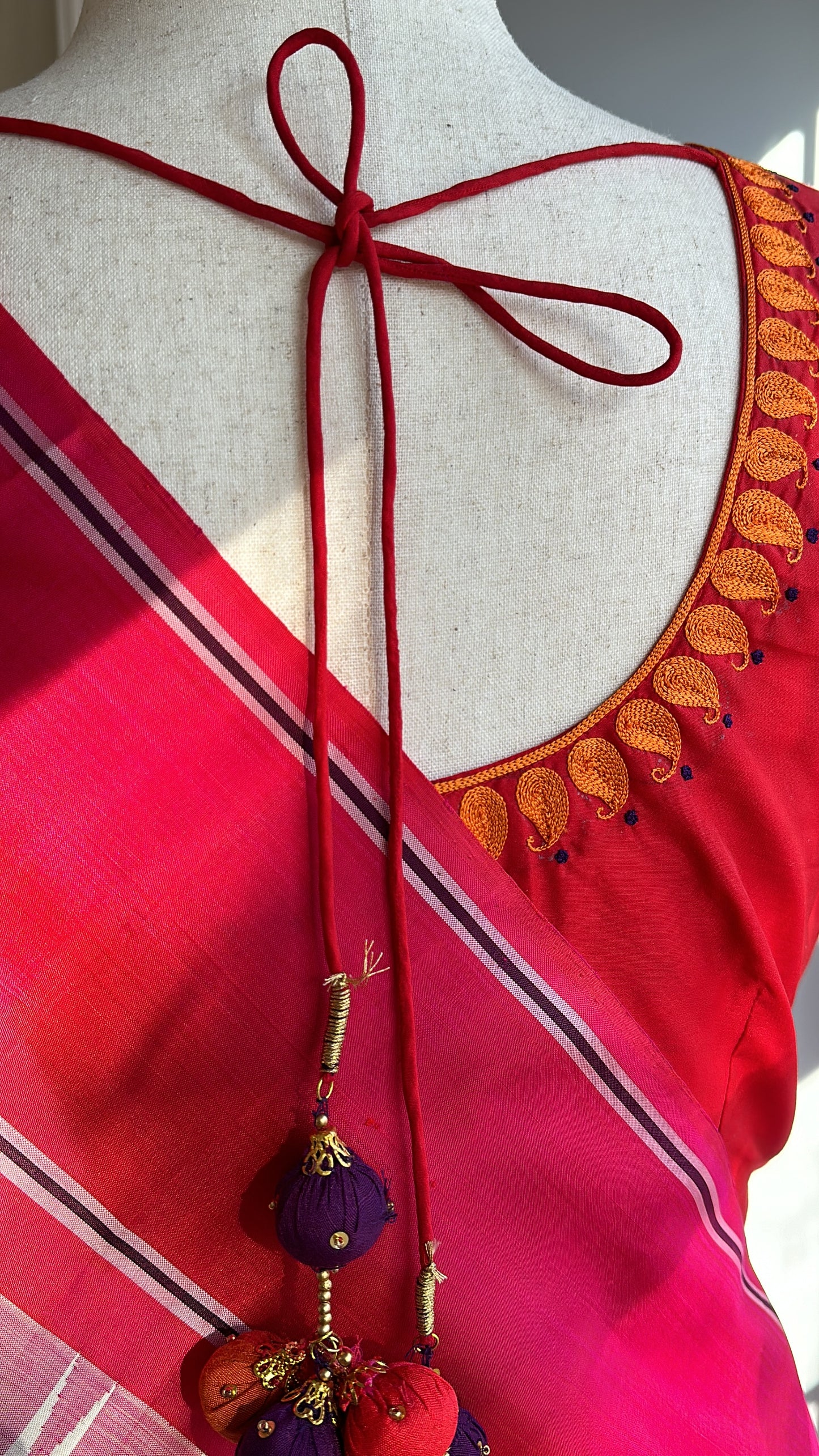 "shree" collection - pure silk embroidery blouse with chosen motifs in ikat silk orange red and purple